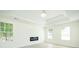 Spacious living room featuring a tray ceiling and a modern electric fireplace at 3554 Cherry Bloom Way, Decatur, GA 30034
