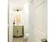 Charming powder room with vintage-style vanity and updated lighting at 3554 Cherry Bloom Way, Decatur, GA 30034