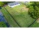 Large, fenced backyard with mature trees, a firepit, and ample space for outdoor recreation and entertainment at 4699 Ballew Dr, Powder Springs, GA 30127