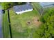 Spacious backyard with a fire pit area and mature trees, providing ample space for outdoor activities at 4699 Ballew Dr, Powder Springs, GA 30127