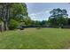 Expansive backyard with lush green grass and privacy fencing, perfect for outdoor activities at 4699 Ballew Dr, Powder Springs, GA 30127