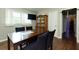 Dining area with a wooden table, chairs, and large windows for natural light at 4699 Ballew Dr, Powder Springs, GA 30127