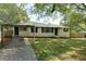 Charming single-story home with a carport and a well-maintained front yard at 4699 Ballew Dr, Powder Springs, GA 30127