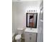 Modern bathroom vanity with elegant countertop and ample storage space, plus large mirror at 528 Lantern Wood Dr, Scottdale, GA 30079