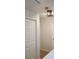 Bright hallway with neutral walls, lighting fixture and multiple doorways at 528 Lantern Wood Dr, Scottdale, GA 30079