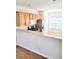 Open kitchen with breakfast bar, stainless steel appliances, wood cabinets and lots of natural light at 528 Lantern Wood Dr, Scottdale, GA 30079