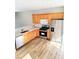 Bright kitchen features stainless steel appliances, granite countertops, and wood cabinets at 528 Lantern Wood Dr, Scottdale, GA 30079