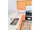 Modern kitchen features stainless steel appliances, granite countertops, and wood cabinets at 528 Lantern Wood Dr, Scottdale, GA 30079