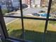 View from a home window looking at a neighborhood lawn at 528 Lantern Wood Dr, Scottdale, GA 30079