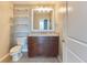 This bathroom features a stylish vanity, a large mirror, and convenient shelving for storage at 860 Peachtree Ne St # 1010, Atlanta, GA 30308