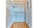 Organized closet with multiple shelving units and metal racks for shoe storage at 860 Peachtree Ne St # 1010, Atlanta, GA 30308