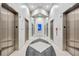 Modern elevator bay featuring updated elevators, lighting, and a decorative floor pattern at 860 Peachtree Ne St # 1010, Atlanta, GA 30308