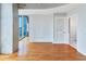 Bright living space featuring hardwood floors and an open balcony, offering city views at 860 Peachtree Ne St # 1010, Atlanta, GA 30308