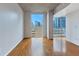 Bright, open living area features hardwood floors and expansive views of the city skyline at 860 Peachtree Ne St # 1010, Atlanta, GA 30308