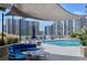 This outdoor pool area offers a relaxing atmosphere with comfortable seating and partial shade on a sunny day at 860 Peachtree Ne St # 1010, Atlanta, GA 30308