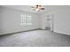 Spacious bedroom with a large window for natural light and a walk-in closet at 961 Old Conyers Rd, Stockbridge, GA 30281