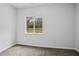 Cozy, carpeted bedroom with a window that invites natural light and offers a pleasant view at 961 Old Conyers Rd, Stockbridge, GA 30281