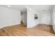 Spacious living room with modern pendant lighting and beautiful hardwood flooring at 961 Old Conyers Rd, Stockbridge, GA 30281