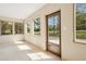 Charming sun room features tile flooring, multiple windows, and natural light throughout at 961 Old Conyers Rd, Stockbridge, GA 30281