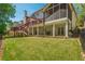 A view of the home's backyard featuring a multi-level deck and screened in porch at 10575 Wren Ridge Rd, Alpharetta, GA 30022