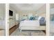 Tranquil main bedroom boasts soft natural light, a serene color palette, and private entrance to a balcony at 10575 Wren Ridge Rd, Alpharetta, GA 30022