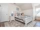 Bedroom features hardwood flooring, decorative rug, and ample natural light at 10575 Wren Ridge Rd, Alpharetta, GA 30022