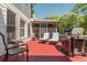 Outdoor deck space with seating, a grill, and views of the surrounding greenery at 10575 Wren Ridge Rd, Alpharetta, GA 30022