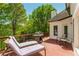 Outdoor deck space featuring a grill and ample seating, with surrounding greenery at 10575 Wren Ridge Rd, Alpharetta, GA 30022