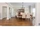 Elegant dining room featuring hardwood floors, a classic chandelier, and ample natural light at 10575 Wren Ridge Rd, Alpharetta, GA 30022
