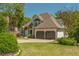 Stunning two-story home with lush landscaping, a two-car garage, and an inviting entrance at 10575 Wren Ridge Rd, Alpharetta, GA 30022