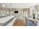Open-concept kitchen and dining area flow into the living space, featuring quartz counters and stainless appliances at 10575 Wren Ridge Rd, Alpharetta, GA 30022