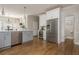 Open concept kitchen featuring stainless appliances, wine cooler and breakfast area at 10575 Wren Ridge Rd, Alpharetta, GA 30022