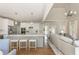 Spacious kitchen flows into living area, featuring large island, stainless appliances, and ample counter space at 10575 Wren Ridge Rd, Alpharetta, GA 30022