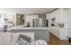 Modern kitchen features a spacious island, stainless steel appliances, and seamless flow to the living area at 10575 Wren Ridge Rd, Alpharetta, GA 30022