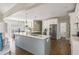 Bright, open kitchen features a large island, stainless steel appliances, and hardwood floors throughout at 10575 Wren Ridge Rd, Alpharetta, GA 30022