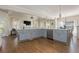 Open concept kitchen with large island, stainless steel appliances and hardwood floors at 10575 Wren Ridge Rd, Alpharetta, GA 30022