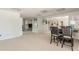 Spacious living room featuring neutral carpet, recessed lighting and dining table at 10575 Wren Ridge Rd, Alpharetta, GA 30022