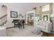 Bright, neutral living room with high ceilings, hardwood floors, piano, and a rug that brings the room together at 10575 Wren Ridge Rd, Alpharetta, GA 30022