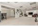 Spacious living room area with neutral carpet, adjacent entertainment and office areas at 10575 Wren Ridge Rd, Alpharetta, GA 30022