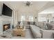 Bright living room boasts a fireplace, soaring ceilings, and ample seating on a large sectional sofa at 10575 Wren Ridge Rd, Alpharetta, GA 30022