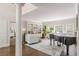 Inviting living room with bookshelves, a piano and lots of natural light at 10575 Wren Ridge Rd, Alpharetta, GA 30022