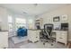 Bright home office with built-in desk, bay windows, and hardwood flooring at 10575 Wren Ridge Rd, Alpharetta, GA 30022