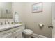 Stylish powder room with marble countertop and decorative mirror at 10575 Wren Ridge Rd, Alpharetta, GA 30022