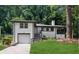 Charming exterior elevation featuring a garage and landscaped front yard perfect for a Gathering at 1753 Detroit Nw Ave, Atlanta, GA 30314