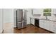 Modern kitchen with stainless steel appliances, white cabinets, and granite countertops at 1753 Detroit Nw Ave, Atlanta, GA 30314