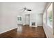 Bright living room with hardwood floors, a cozy fireplace, ceiling fan, and a window at 1753 Detroit Nw Ave, Atlanta, GA 30314