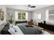 Relaxing main bedroom with stylish decor, large windows, and a ceiling fan at 1753 Detroit Nw Ave, Atlanta, GA 30314