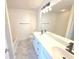 Bathroom featuring marble tile flooring, dual sinks, shower and tub with modern fixtures at 1960 Dakota Nw Dr, Acworth, GA 30101