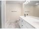 Bathroom featuring marble tile flooring, dual sinks, shower and tub with modern fixtures at 1960 Dakota Nw Dr, Acworth, GA 30101