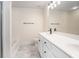 Bathroom featuring double sink vanity with marble floors, sleek black hardware, and integrated tub at 1960 Dakota Nw Dr, Acworth, GA 30101